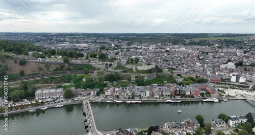 Citadel of Namur above the Sambre river historic landmark in Namur, Belgium, city view, urban landscape. Buildings and infrastructure, Aerial drone video. photo