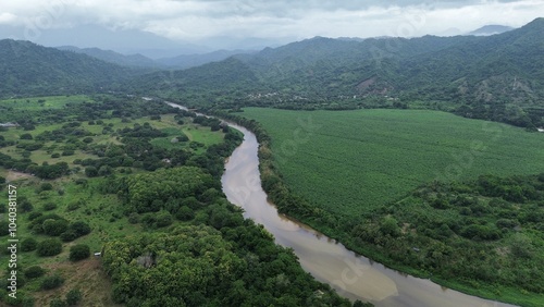 Aerial photo of Palomino beach in Colombia. Palomino river flowing into the sea. Touristic place used for river tubing