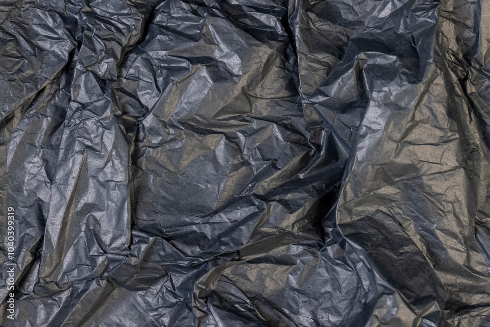 a piece of black soft paper for packaging goods and objects a piece of black soft paper for packaging goods and objects