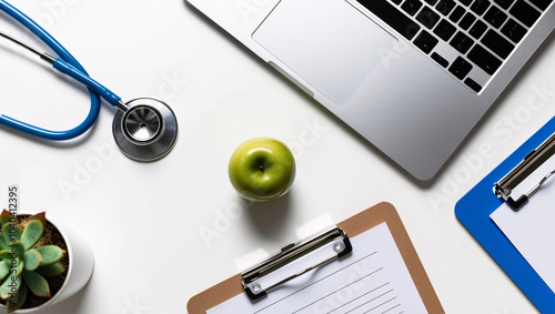 Minimalist Workspace High-Angle View Featuring a Silver Laptop, Stethoscope, Green Apple, Clipboard, and Succulent Plant, Emphasizing Clean Lines and Health Themes