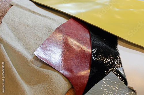 colorful leather scraps in various sizes after being processed in an industrial tannery photo