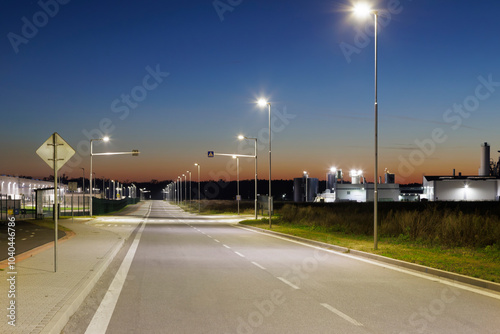 night empty road with modern led street lights in industrial zone