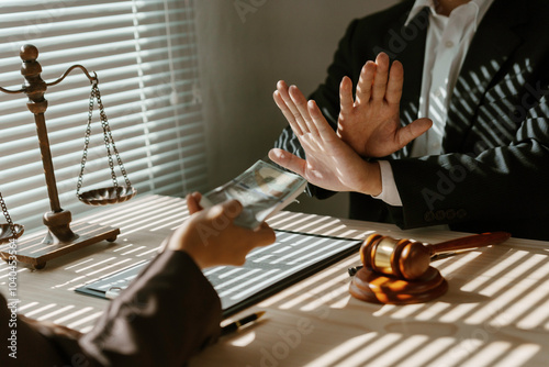 Lawyer refusing bribe from businesswoman at meeting about contract, concept of corruption and anti bribery