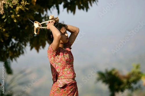 South asian tribal girl standing outdoor wearing traditional dress  photo