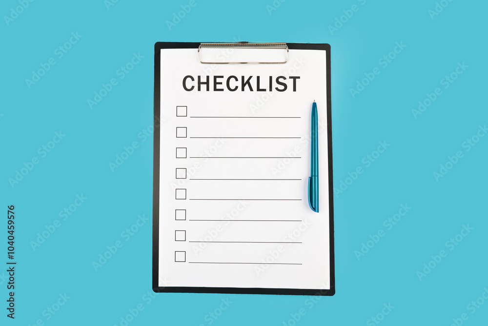Checklist and pen on blue background top view copy space Checklist and pen on blue background top view copy space