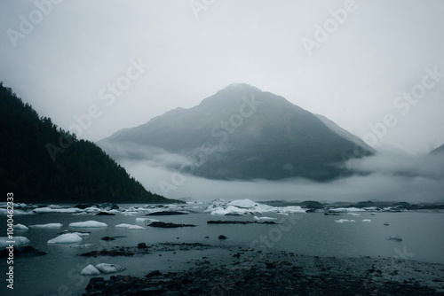 Valdez Glacier Lake with distance mountains in rain and mist, Valdez, Alaska, USA