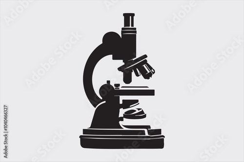 Silhouette of a classic laboratory microscope.