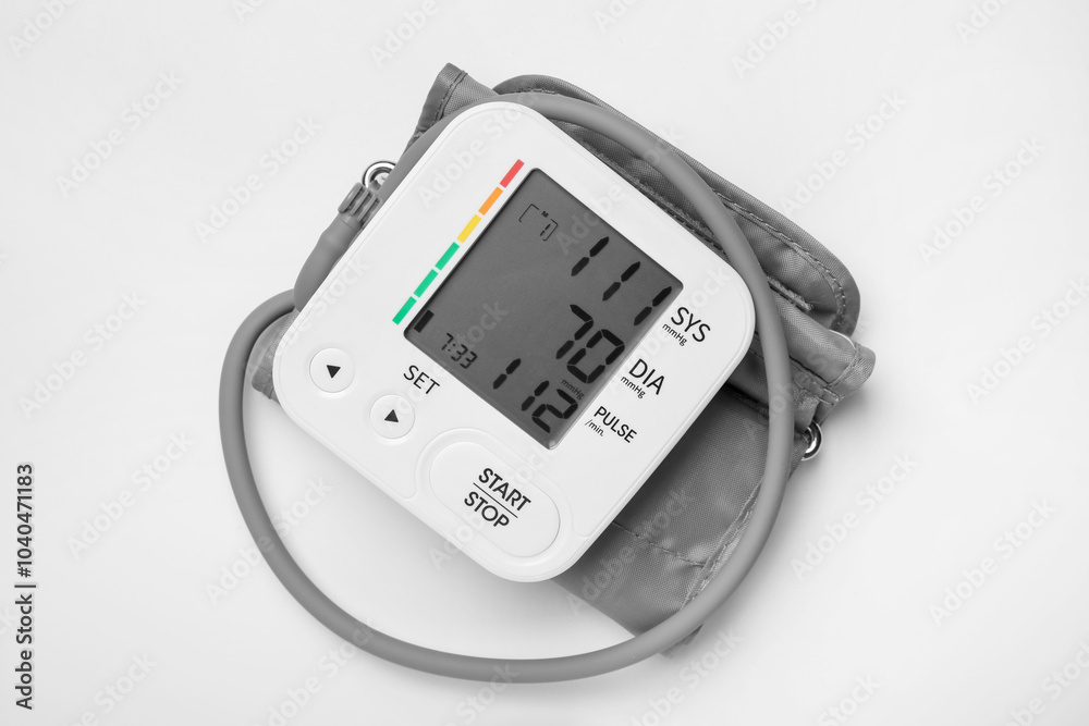 Blood pressure measuring device on light grey background, top view Blood pressure measuring device on light grey background, top view