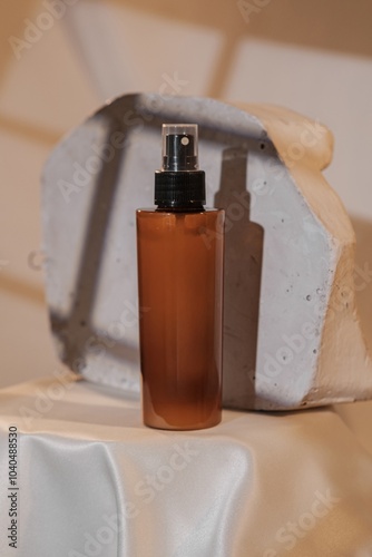 Cosmetic Bottle Mockup in Soft Lighting with White Marble Background and Shadows photo