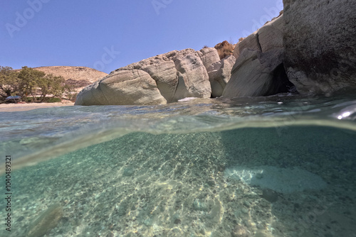 Underwater split photo of famous for sea water clarity sandy paradise beach of Prassa in island of Kimolos, Cyclades, Greece photo