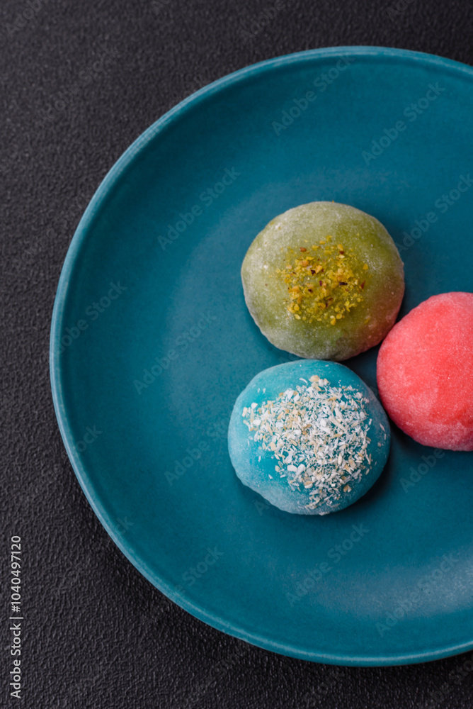 Delicious colorful asian mochi sweets with rice dough shell and fruit filling Delicious colorful asian mochi sweets with rice dough shell and fruit filling