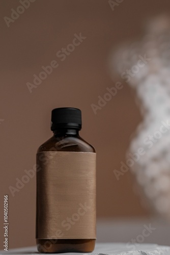 Cosmetic Bottle on Beige Background with Silhouette photo