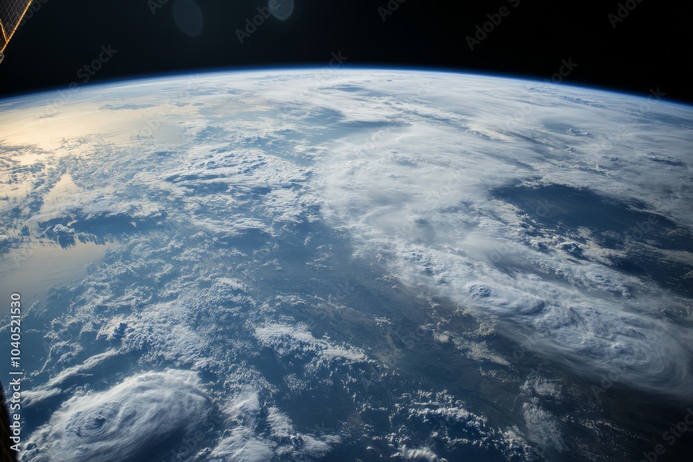 Fototapeta premium A stunning image features Earth enveloped by swirling clouds, offering a striking display of atmospheric dynamics, natural shapes, and the planet's grand scale.
