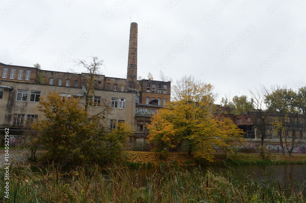 Fototapeta premium The abandoned Torgmash plant on the Lower Pond in Kaliningrad
