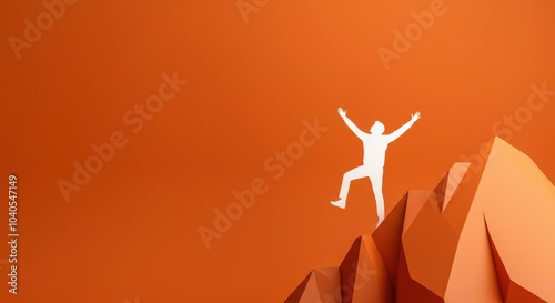 Silhouette of person celebrating on mountain peak with orange background