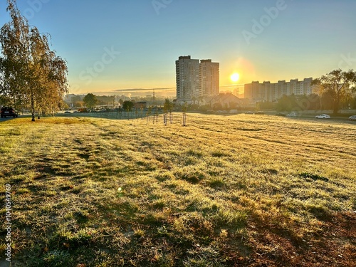 Photo of a magnificent sunrise on a cold autumn day. Frost on withered grass at the end of autumn. photo