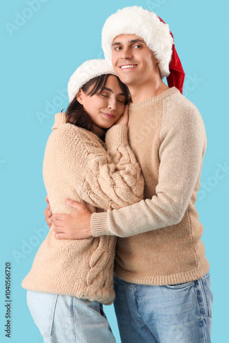 Happy young couple in Santa...