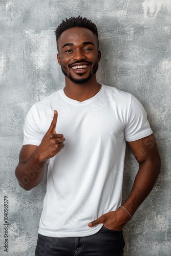 Young man showing number one gesture with a confident smile against a texture...