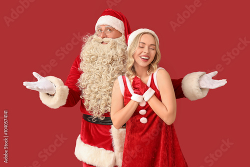 Santa Claus with happy youn...