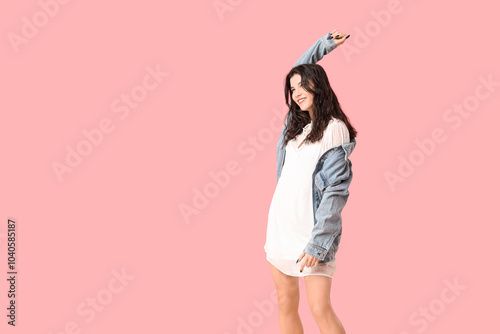 Beautiful young woman in st...
