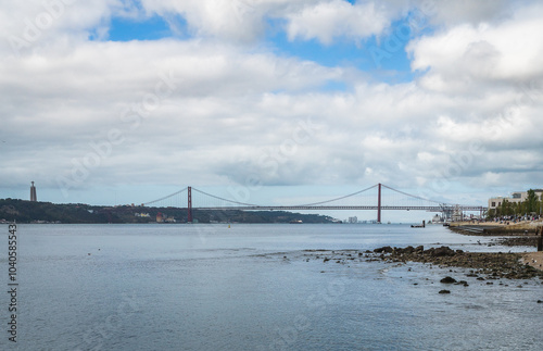 A view of the Tagus River near Lisbon with the famous 25th of April Bridge in the distance. photo