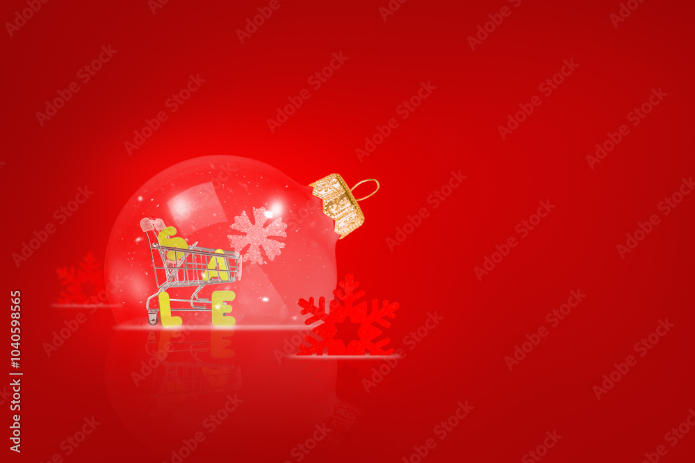 A Christmas card. Transparent Christmas ball on a red background. Sale A Christmas card. Transparent Christmas ball on a red background. Sale