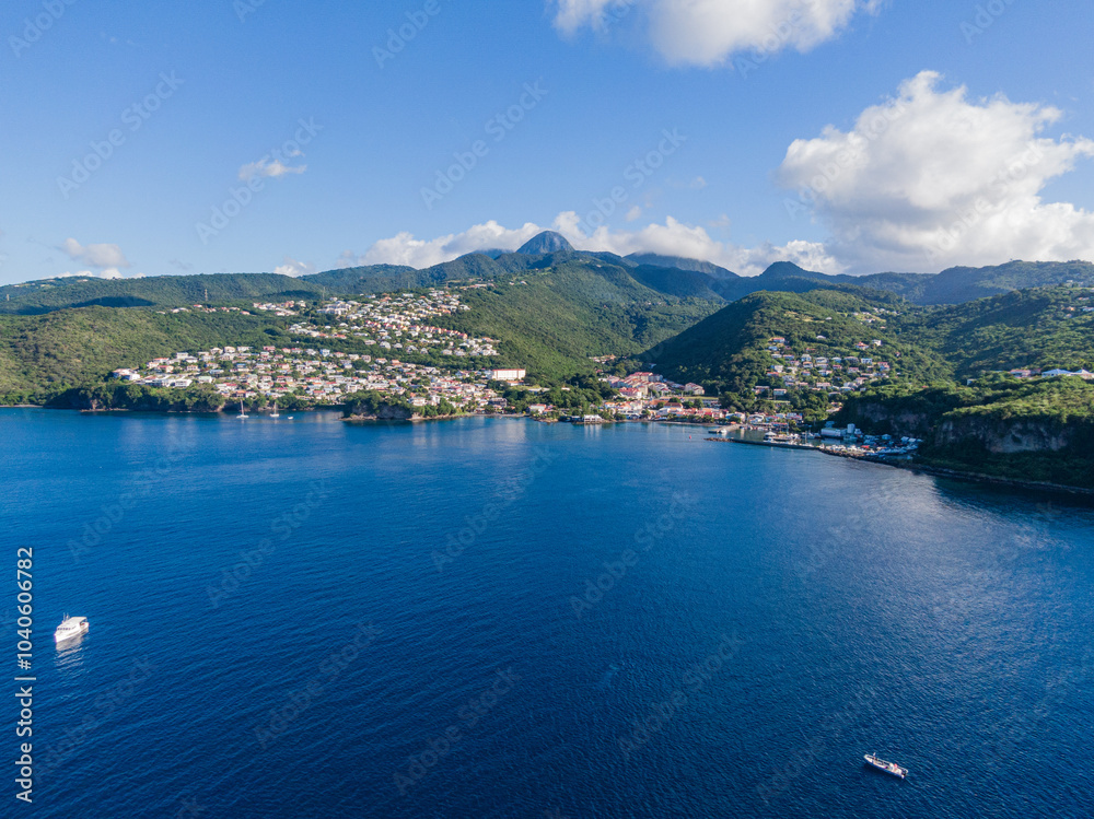 Obraz premium Aerial view of the Bay in front of Case-Pilote with the mountains in the background, Martinique, West Indies, France