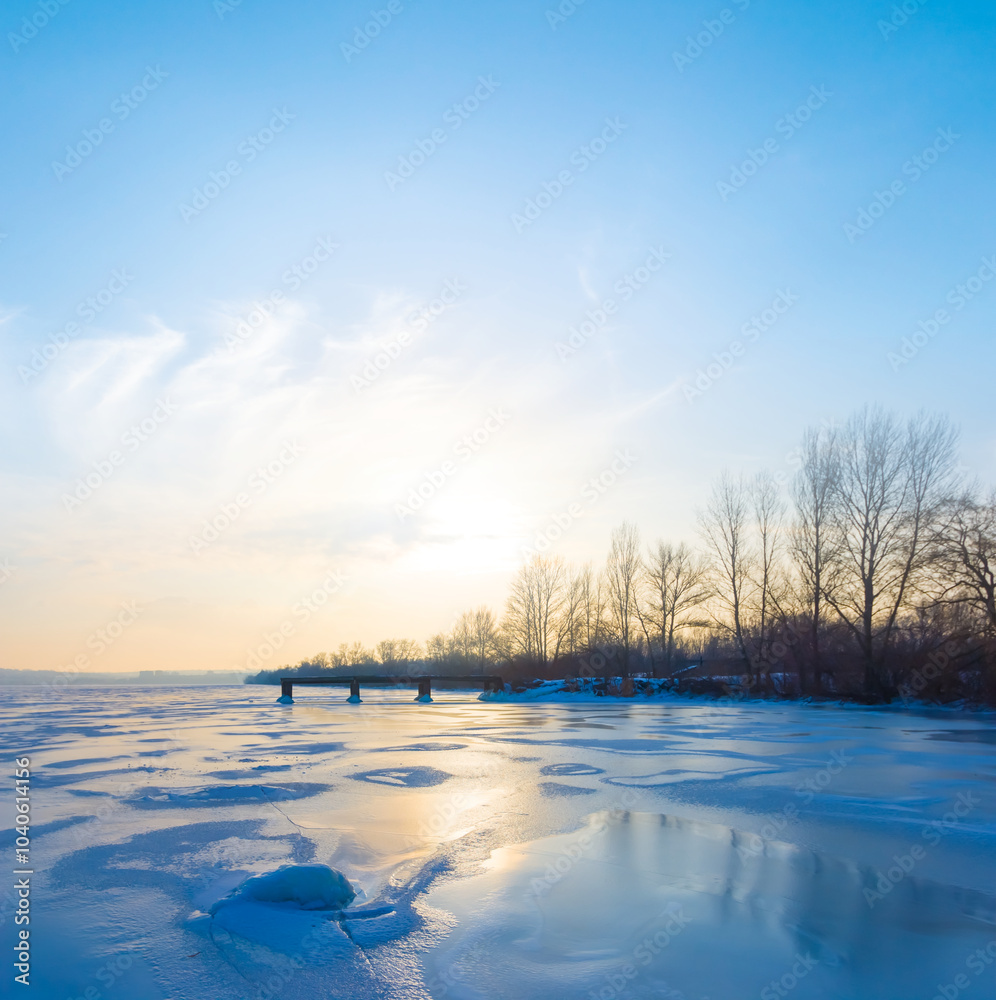 frozen lake at the sunset, natural outdoor seasonal scene frozen lake at the sunset, natural outdoor seasonal scene