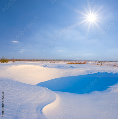 winter snowbound plain at the sunny day