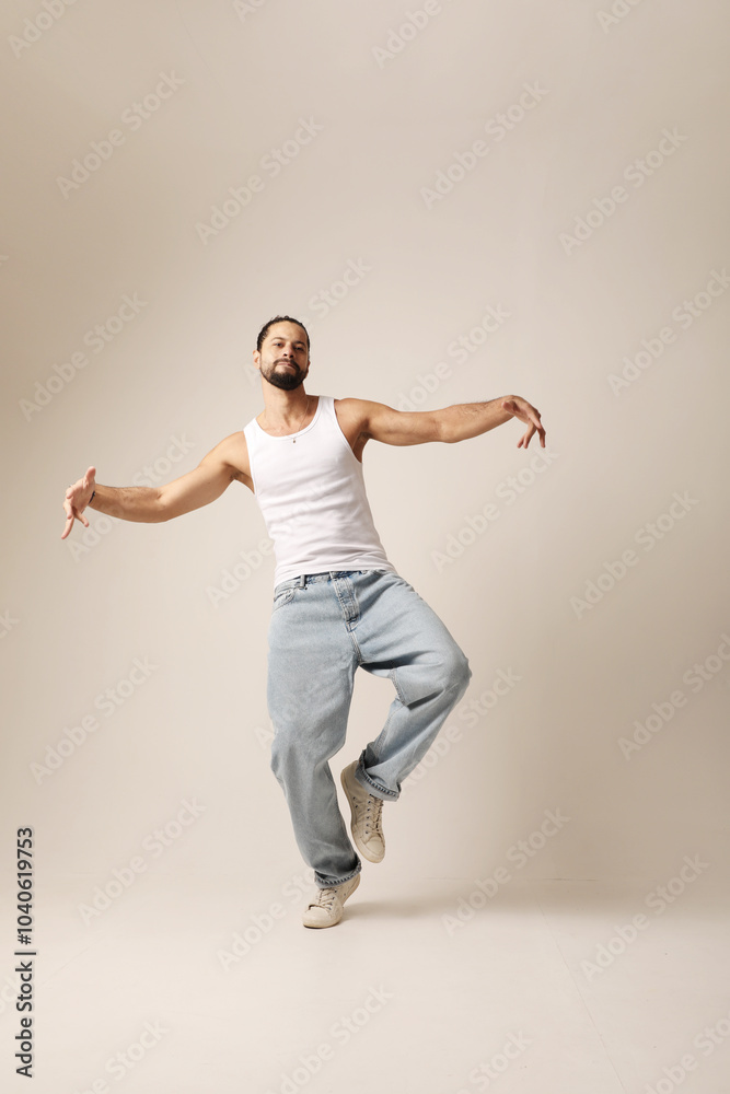 Vertical portrait of happy young man dancing in the studio. Mind set and mental health. Isolated. Vertical portrait of happy young man dancing in the studio. Mind set and mental health. Isolated.