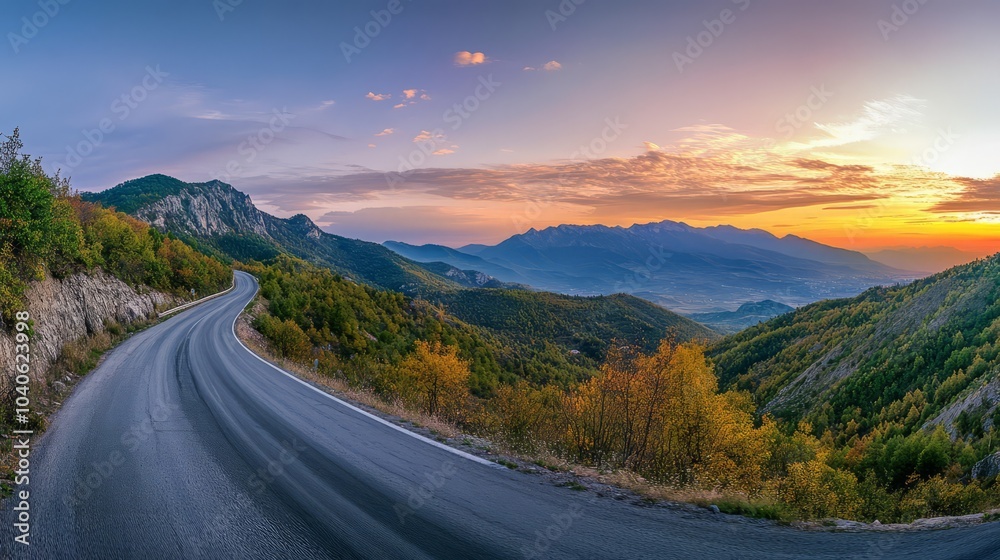 Naklejka premium Serene Mountain Road at Sunset