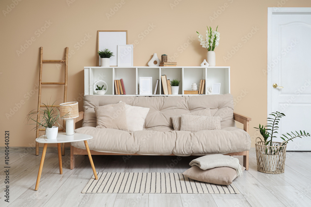 Cozy sofa, shelving unit and coffee table in interior of living room Cozy sofa, shelving unit and coffee table in interior of living room