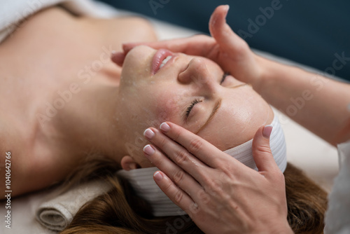 Cosmetologist making rejuvenating face procedures for woman client in spa or salon. Cosmetology concept. Aesthetic cosmetology, face care. Facial lifting in SPA salon. Cosmetic procedure. Beauty.