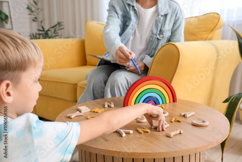 Little boy taking letters f...