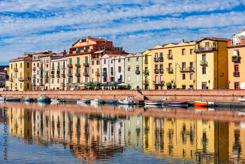 Beautiful view of the picturesque town of Bosa with its colorful houses reflected in the Temo River, Sardinia, Italy.