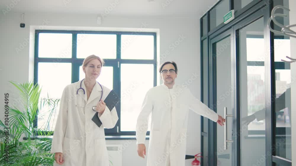 In a modern hospital corridor, a group of doctors is deeply engaged in a meaningful discussion about enhancing patient care and service In a modern hospital corridor, a group of doctors is deeply engaged in a meaningful discussion about enhancing patient care and service