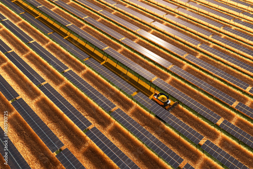 Obraz na płótnie Aerial View of Solar Panels and Agriculture Harvester in Sustainable Farm w salonie