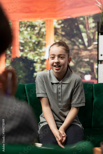 Psychologist listens to girl at counseling session dealing with anxiety, trying to overcome intrusive thoughts and low confidence. Therapist helps her manage behavioral issues.