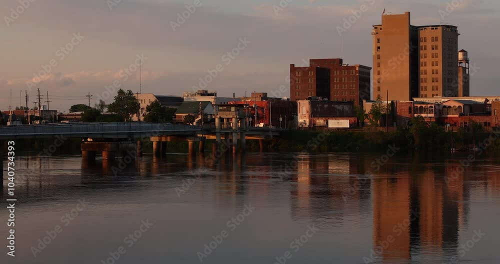 Monroe, Louisiana, USA - April 4, 2024: Afternoon sunlight shines on the historic buildings in the skyline of downtown Monroe. Monroe, Louisiana, USA - April 4, 2024: Afternoon sunlight shines on the historic buildings in the skyline of downtown Monroe.