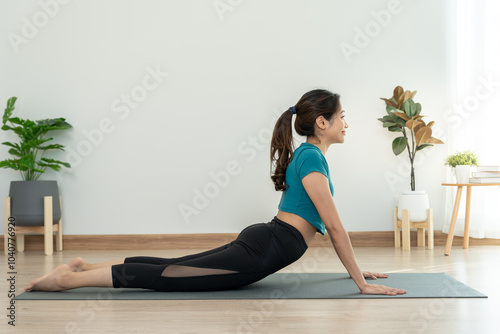 Obraz na plátně Slim asian woman practice yoga activity in condo or home