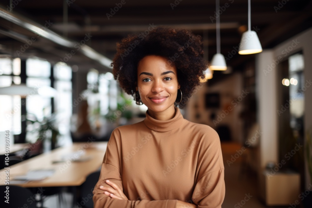 Portrait of a smiling young African American hipster woman in office Portrait of a smiling young African American hipster woman in office