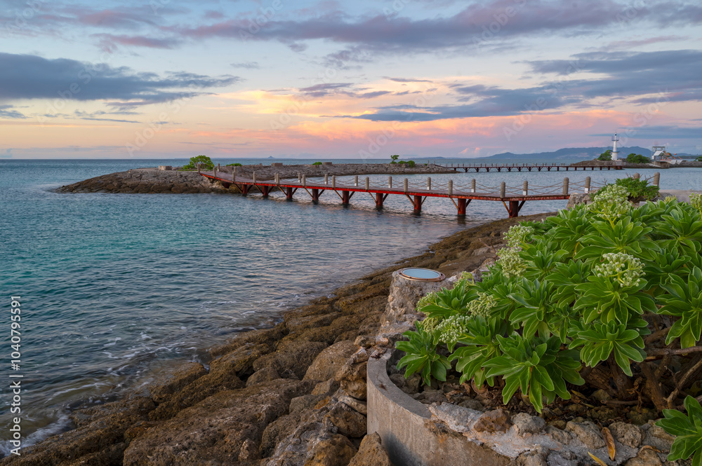 The beautiful island of Okinawa main island, in the Ryukyu Islands of Japan, with pristine waters and beaches is relatively unspoiled The beautiful island of Okinawa main island, in the Ryukyu Islands of Japan, with pristine waters and beaches is relatively unspoiled
