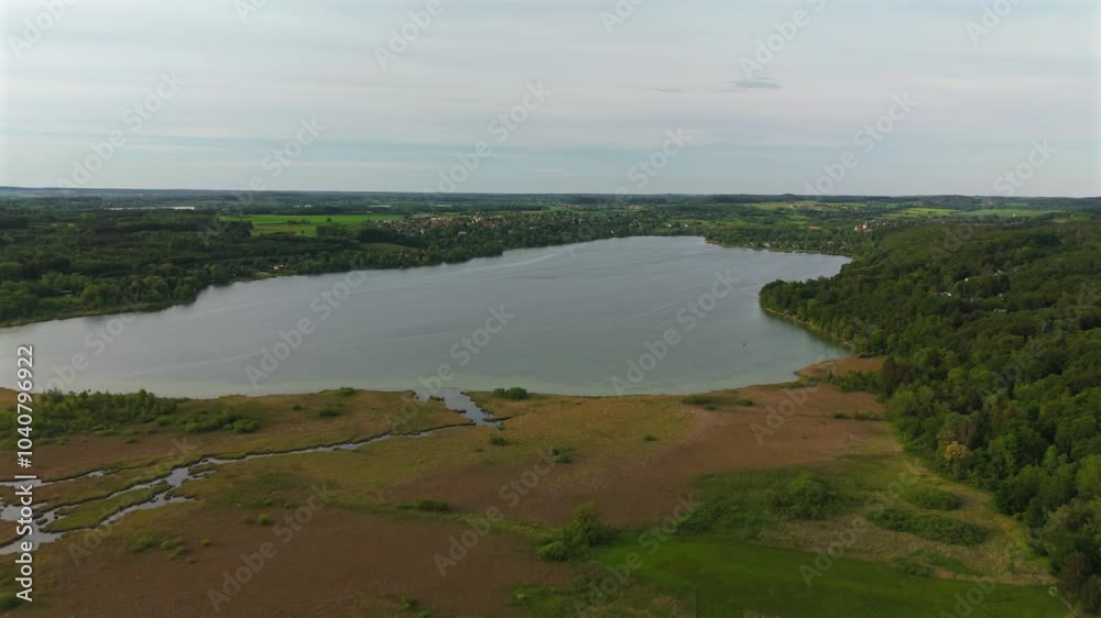 Drone view Pilsensee See in Bayern, Seefeld, Hechendorf Deutschland Luftaufnahme. Aerial view of lake Pilsensee shared lake area with Lake Ammer in Bavaria, Germany near Munich. Drone view Pilsensee See in Bayern, Seefeld, Hechendorf Deutschland Luftaufnahme. Aerial view of lake Pilsensee shared lake area with Lake Ammer in Bavaria, Germany near Munich.