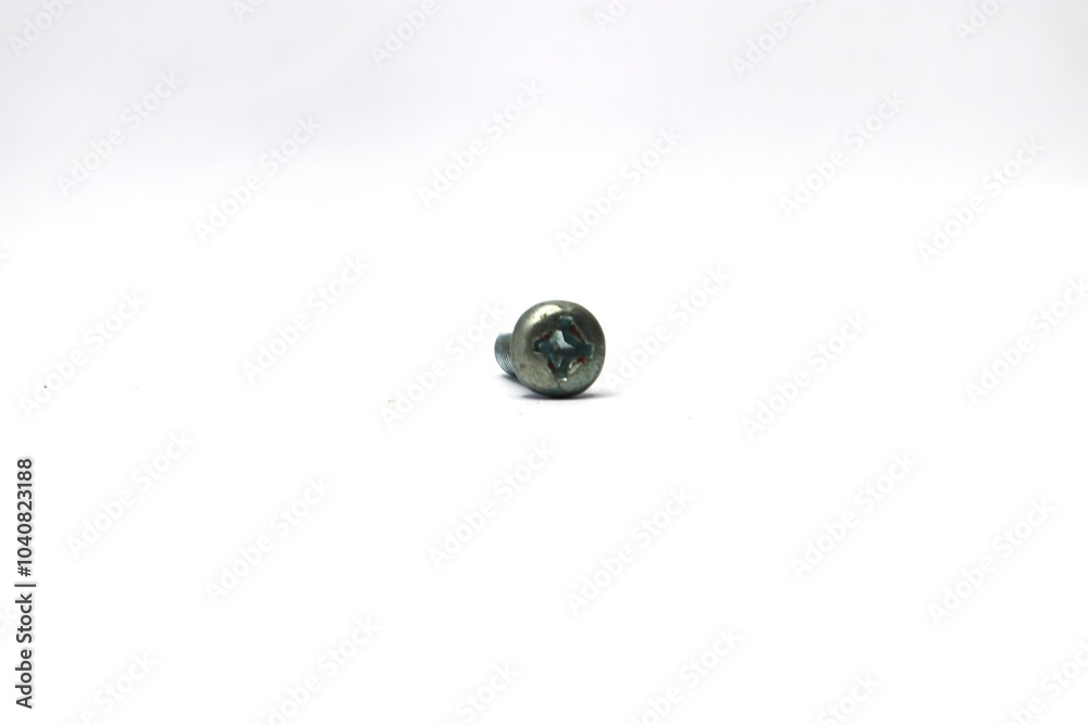 A close-up of a single, silver-colored screw on a white background. A close-up of a single, silver-colored screw on a white background.