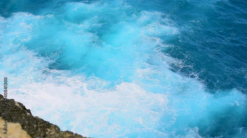 Turquoise ocean sea water white wave splashing deep blue sea. Bird eye view monster wave splash on rock. Tropical sea beach in summer seaside outdoor. Ocean island beautiful dramatic landscape. Turquoise ocean sea water white wave splashing deep blue sea. Bird eye view monster wave splash on rock. Tropical sea beach in summer seaside outdoor. Ocean island beautiful dramatic landscape.