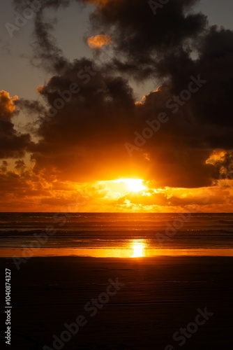 Sunset at Piha beach, New Zealand