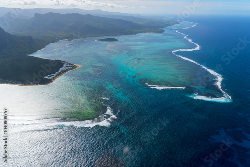 Explore the natural wonders of underwater waterfalls. This video shot from a helicopter reveals the astonishing beauty of this geological phenomenon. Mauritius, Indian Ocean.