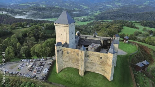 Aerial view on Mauvezin castle, a fortress with a medieval military architecture located in Occitania, France (orbital forward) photo