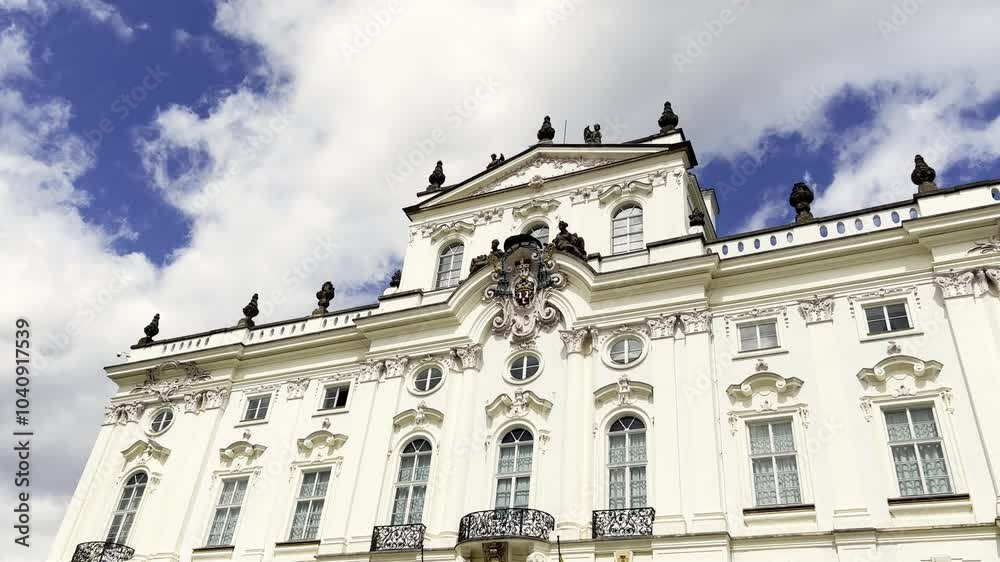 A beautiful old building of white color on the background of the sky. Prague architecture. A beautiful old building of white color on the background of the sky. Prague architecture.