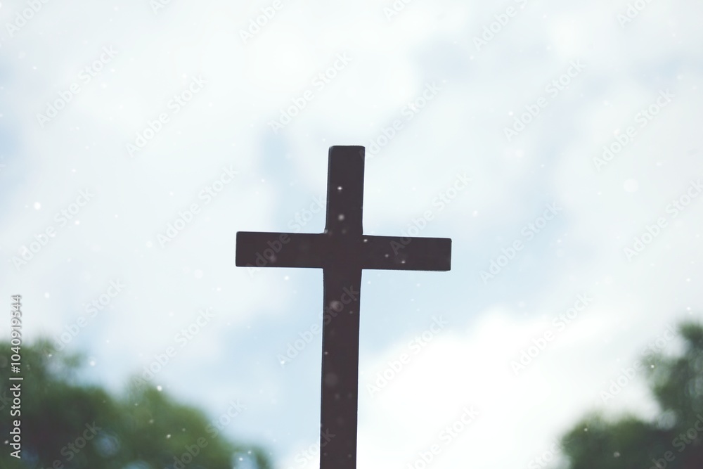 Close up silhouette crucifix with tree and sky Close up silhouette crucifix with tree and sky